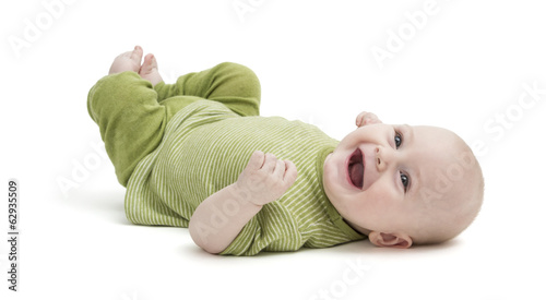 happy toddler lying on his back