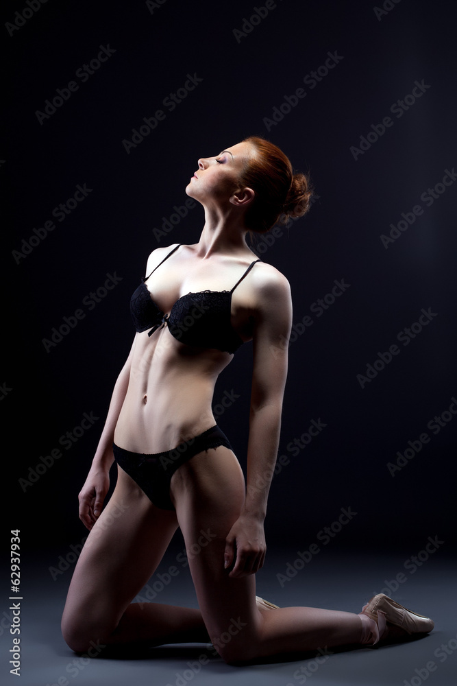 Shot of skinny ballerina posing in erotic lingerie