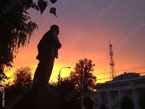 Lenin statue with dramatic red sky photo