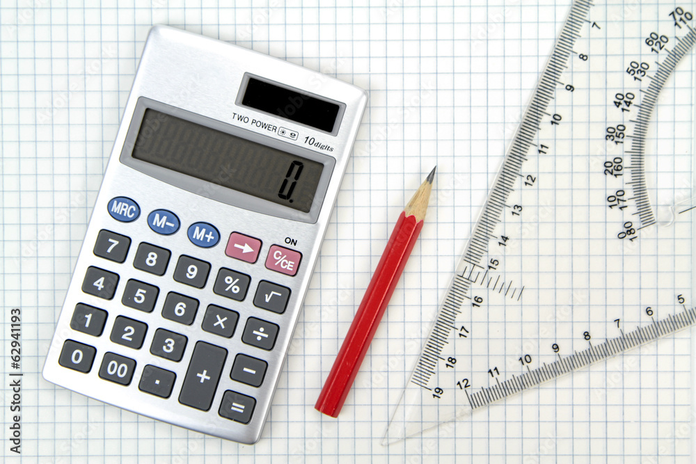 Calculator, lead pencil and ruler on squared paper. Calculator, lead pencil and ruler on squared paper.