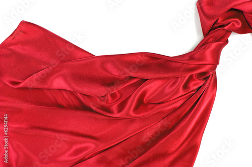 Red rippling silk fabric on white background