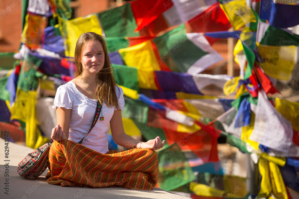 Girl sitting in the Lotus position on Buddhist stupa. Girl sitting in the Lotus position on Buddhist stupa.