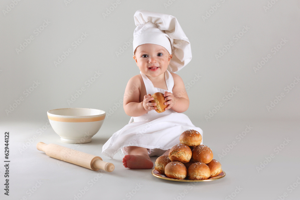 Happy little baby in a cook cap laughs Happy little baby in a cook cap laughs