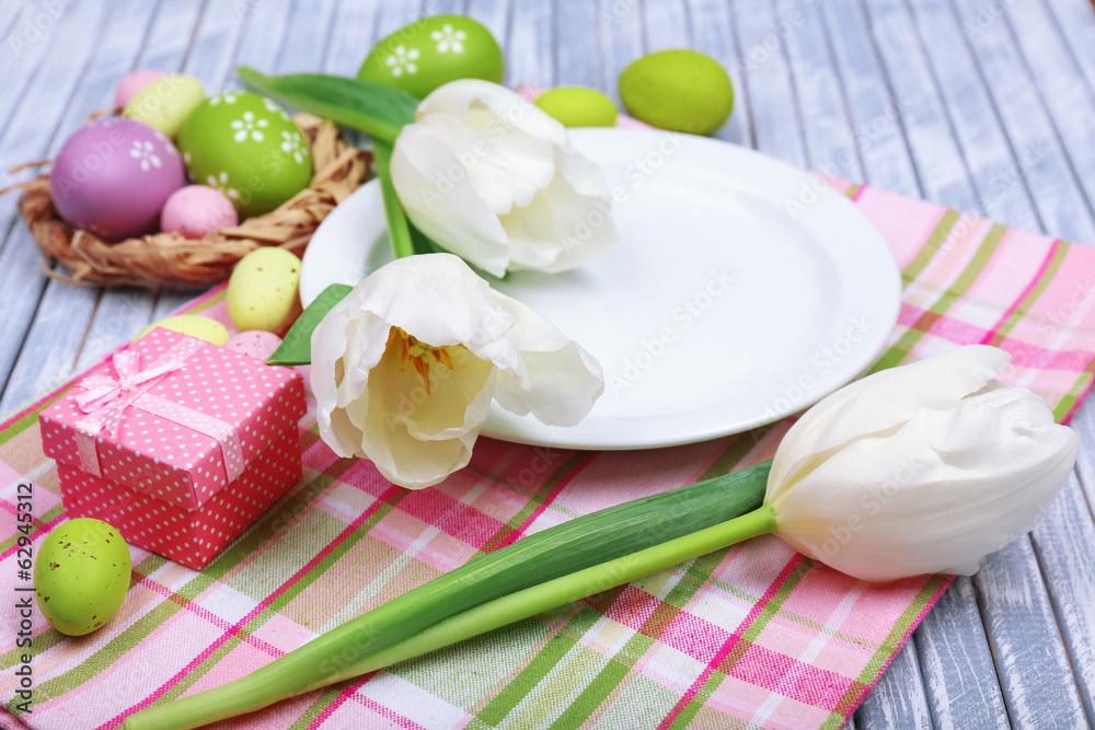 Easter table setting with tulips and eggs