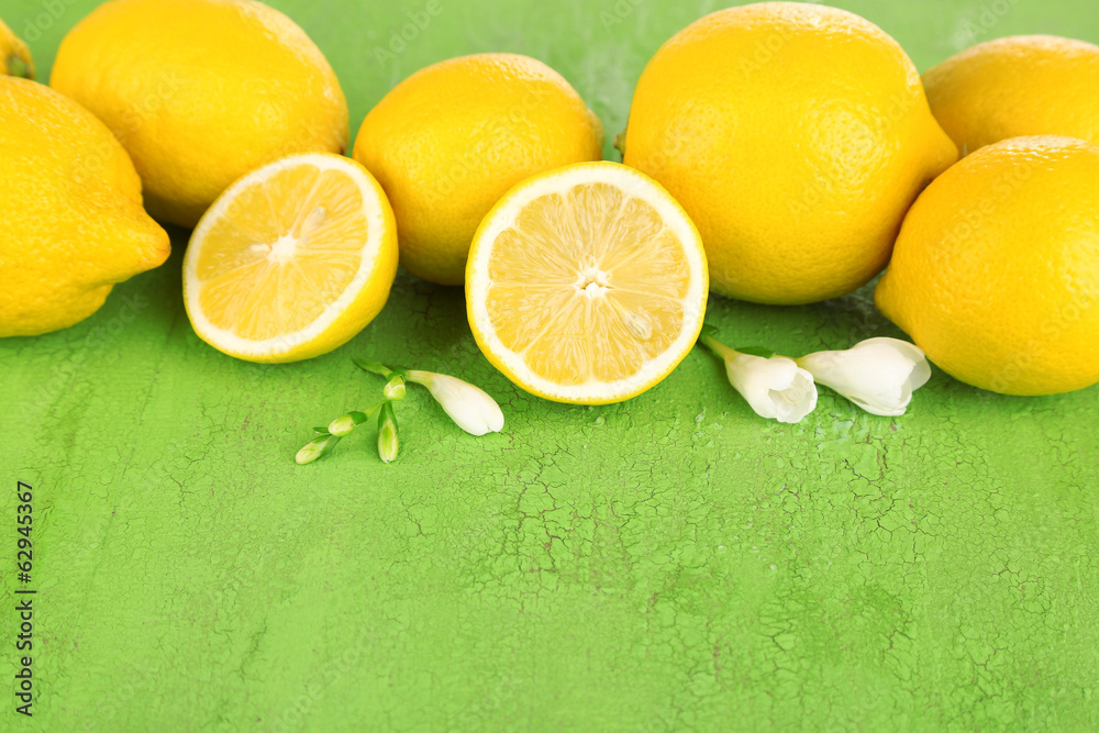 Fresh lemons and lavender on green table Fresh lemons and lavender on green table