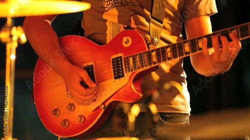 musician plays the guitar during a concert