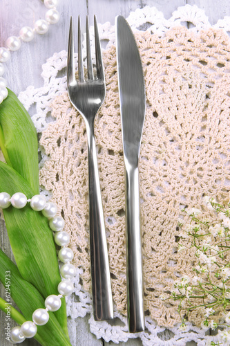 Table place setting with decorations on color wooden background