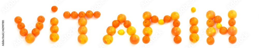 Vitamin written on white background with citrus fruits. Vitamin written on white background with citrus fruits.