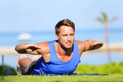 Fitness man training back extension exercise