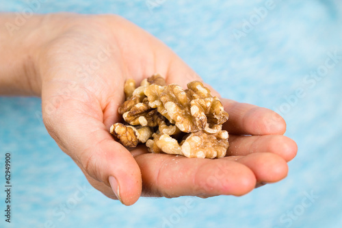 Hand holding walnuts photo