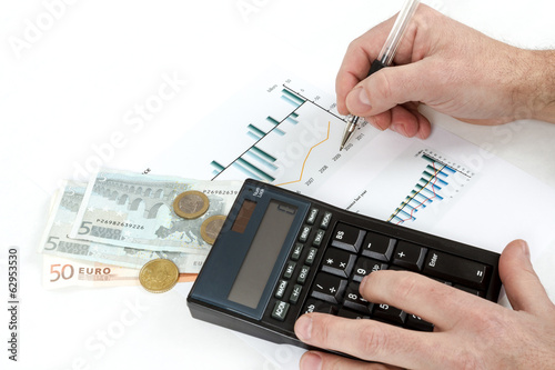 men analyzing business graph with glasses in the background