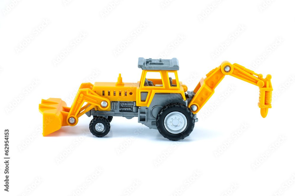 tractor toy in yellow color isolated on white