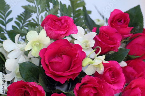 Pink roses and white orchid arrabgement bouquet