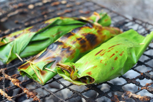 Sticky rice wrapped in banana leaves grill