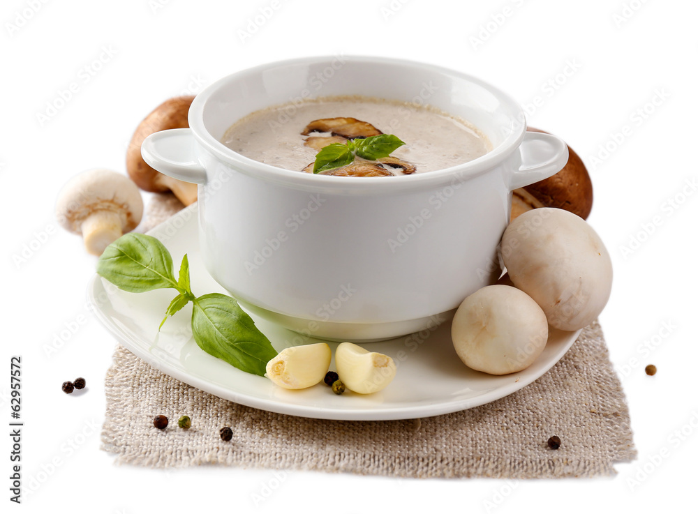 Mushroom soup in white bowl, on napkin, isolated on white Mushroom soup in white bowl, on napkin, isolated on white