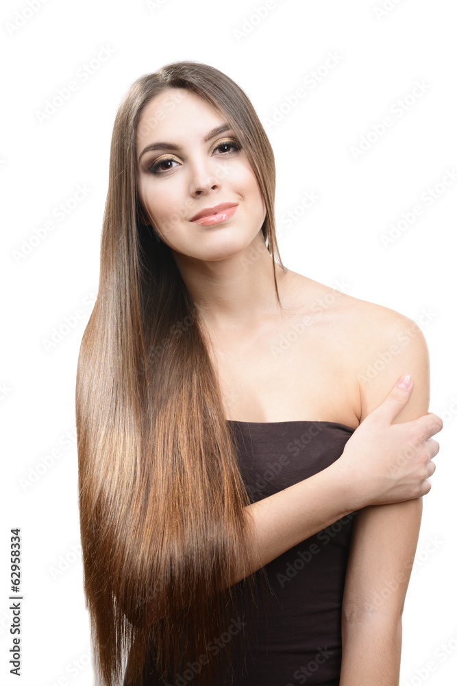 Naklejka premium Beautiful young woman with long hair isolated on white