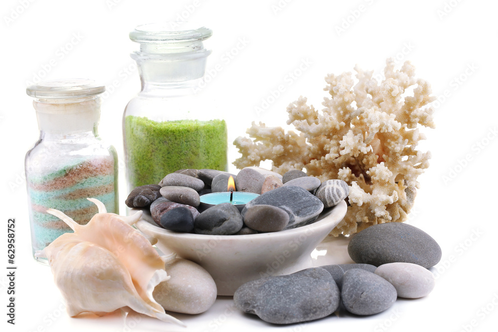 Spa stones with candle, coral and sea salt, isolated on white Spa stones with candle, coral and sea salt, isolated on white