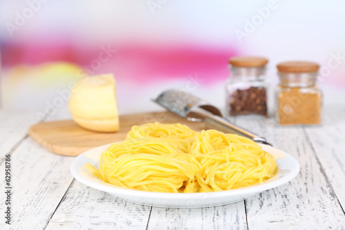 Composition with tasty spaghetti, grater, cheese, and spices