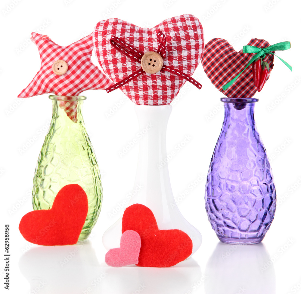 Hand-made textile hearts in different vases, isolated on white Hand-made textile hearts in different vases, isolated on white