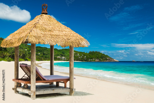 beach beds with roof and turquoise sea