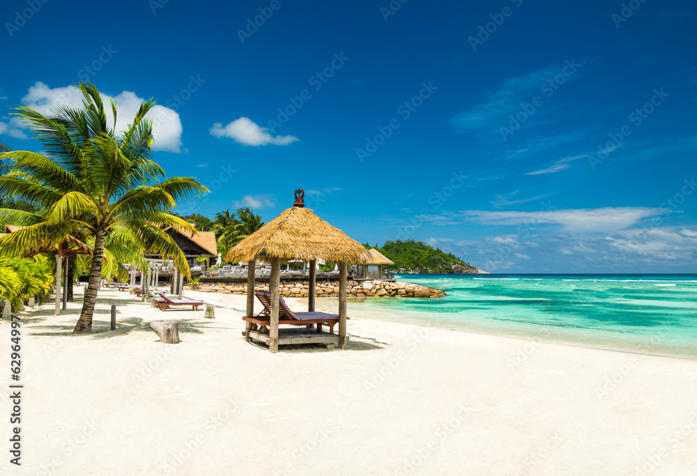 beach beds with roof and turquoise sea