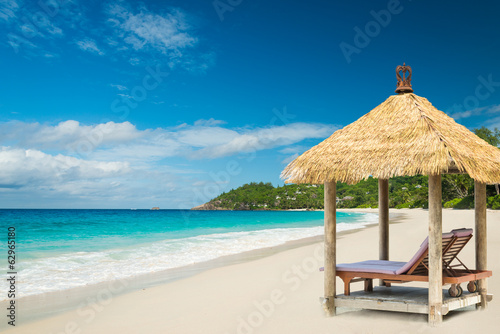 beach beds with roof and turquoise sea