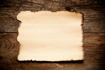 Horizontal old paper on wooden background