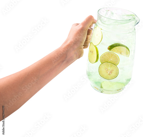 Female hand pouring lime juice
