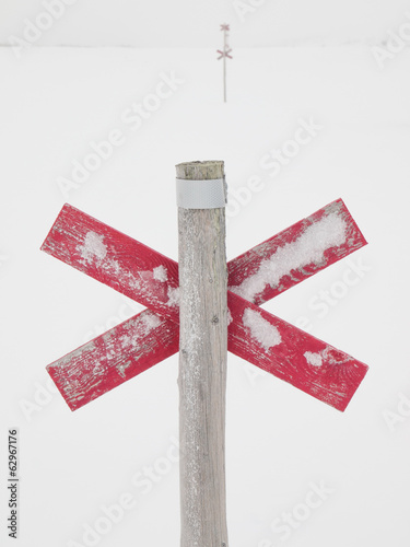 Route markers through arctic winter landscape photo