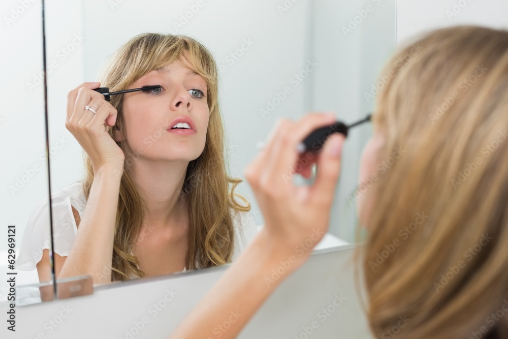 Close-up of a beautiful woman applying mascara Close-up of a beautiful woman applying mascara