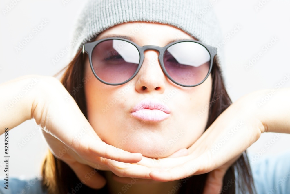Portrait of hipster teenage girl giving kiss Portrait of hipster teenage girl giving kiss