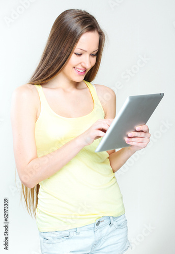 young woman holding tablet computer