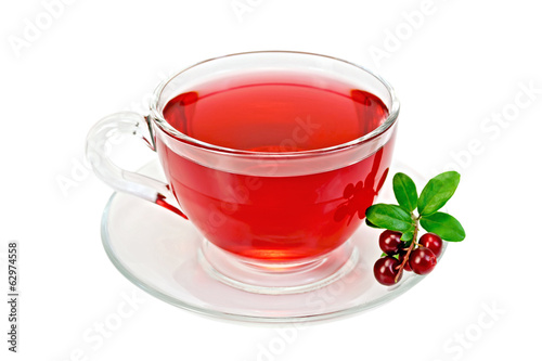 Tea with cranberries in a glass cup