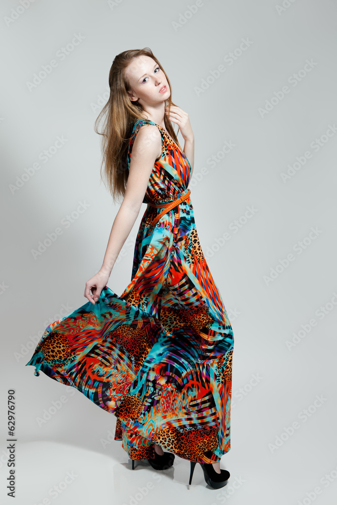 Young woman in a colorfull sundress Young woman in a colorfull sundress