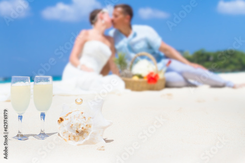 young loving couple on wedding day on tropical sand beach