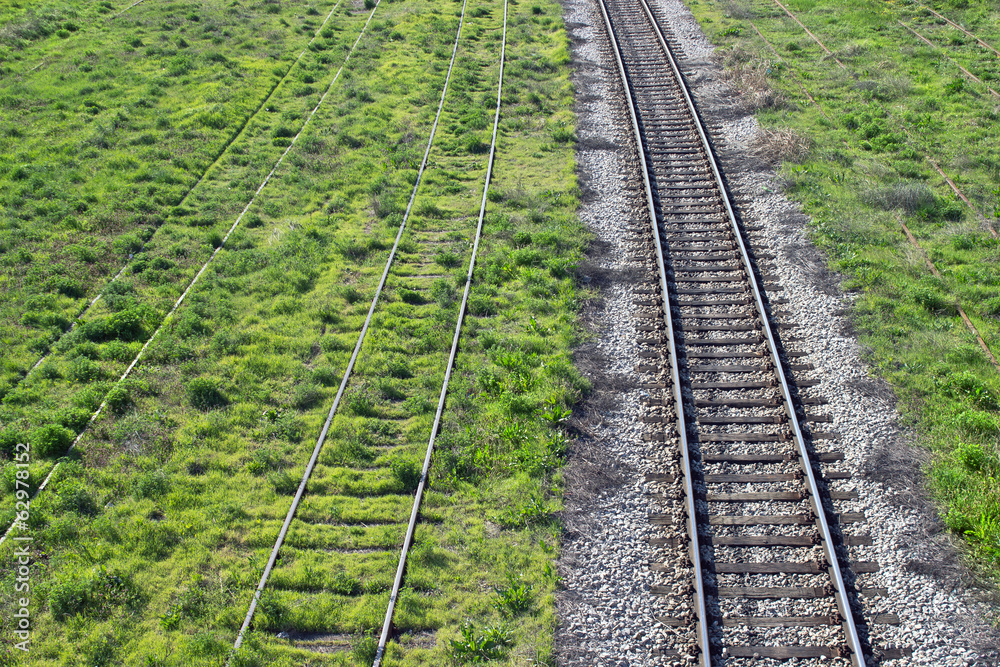 Railroad track through the landscape Railroad track through the landscape