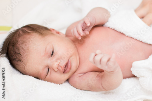newborn baby with towel