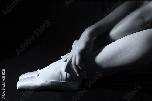 Ballerina sit down on floor to put on slippers prepare  for perf © Alta Oosthuizen