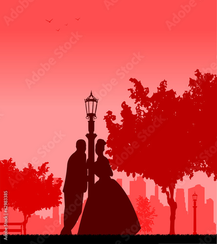 Wedding couple in park posturing silhouette