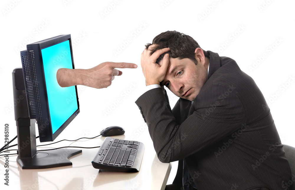Business man in stress with computer accusing finger pointing Business man in stress with computer accusing finger pointing
