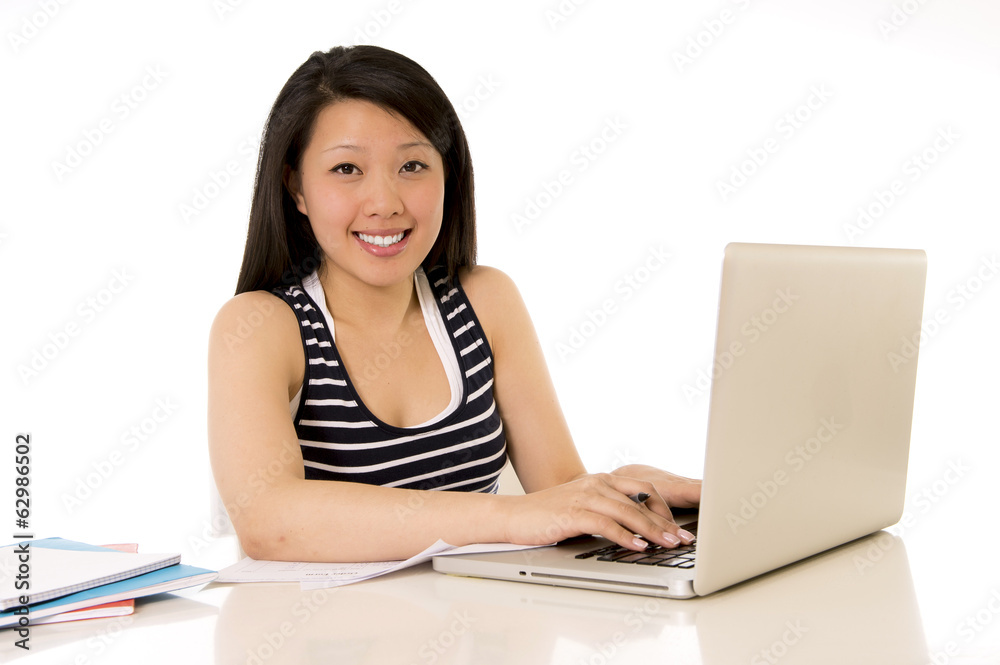 happy chinese asian woman working on her laptop happy chinese asian woman working on her laptop