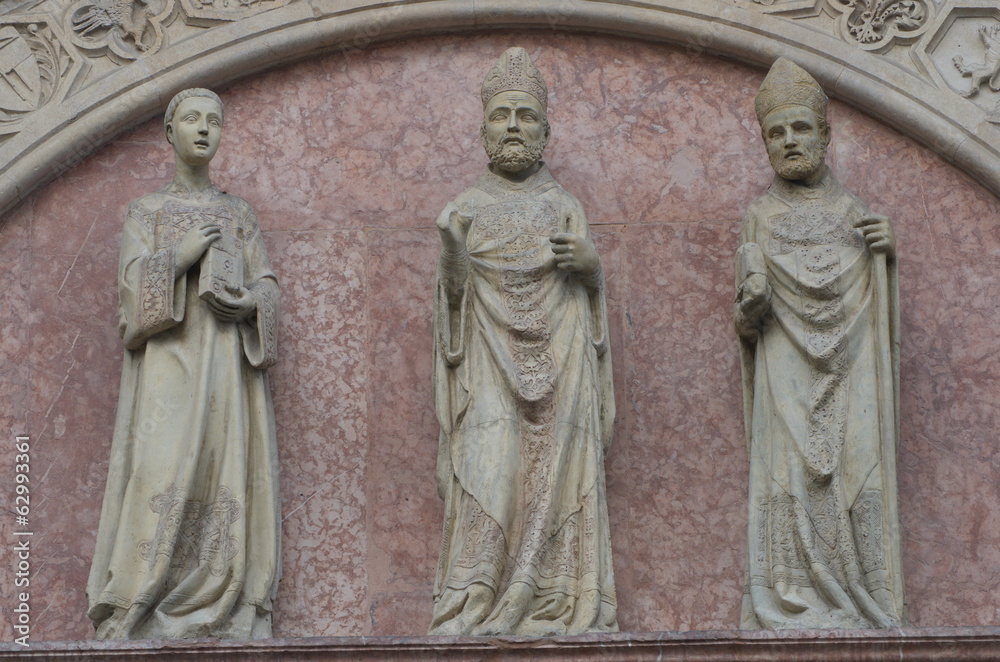 Marble statuettes over the Portale delle Arti, Perugia, Italy