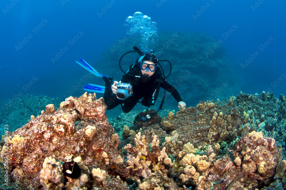 Scuba Diver taking pictures on a Hawaiian Reef Scuba Diver taking pictures on a Hawaiian Reef