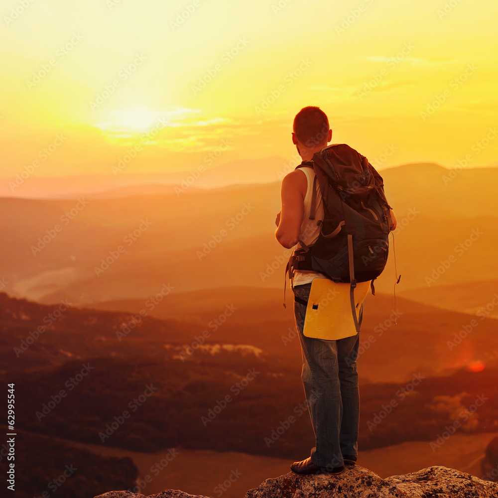 guy in the mountains at sunset. the concept of freedom guy in the mountains at sunset. the concept of freedom