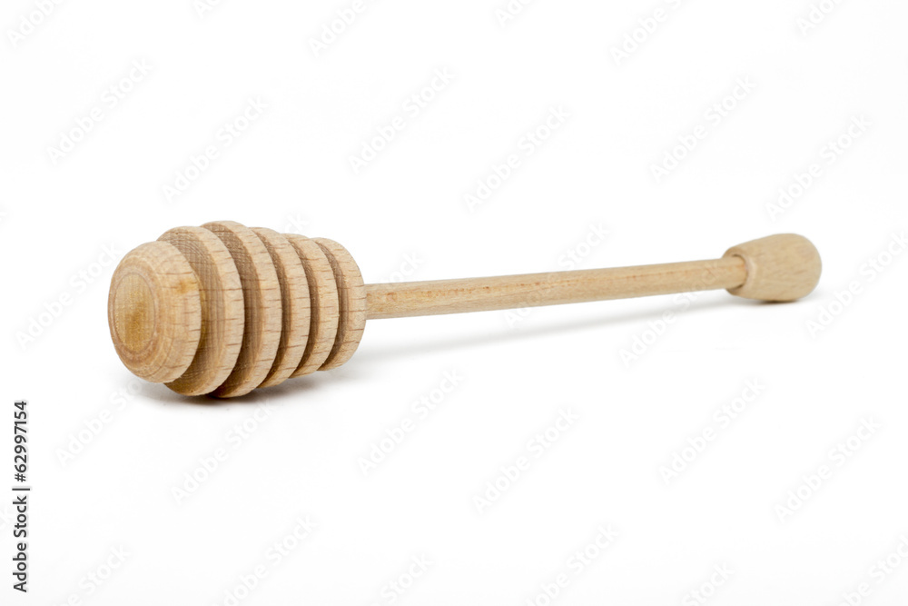 Close up view of a honey dipper isolated on a white background. Close up view of a honey dipper isolated on a white background.