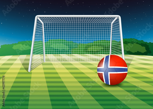 A ball at the field with the flag of Norway