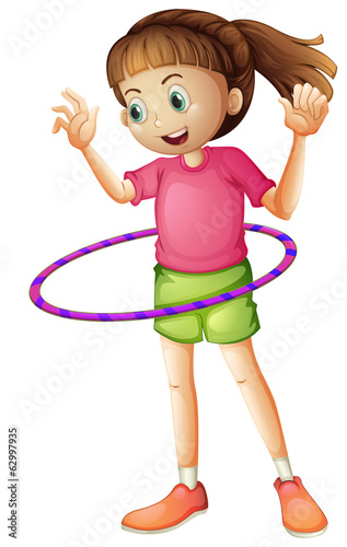 A young girl playing hulahoop
