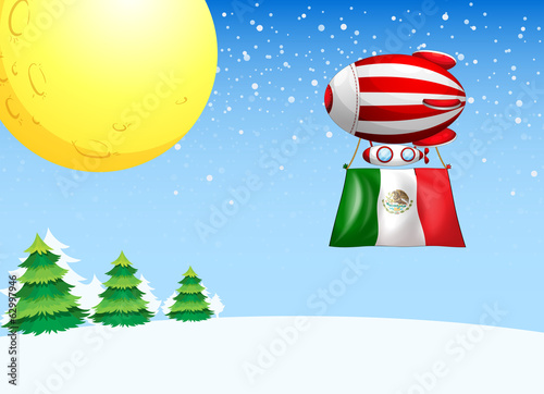 A floating balloon flying with the flag of Mexico