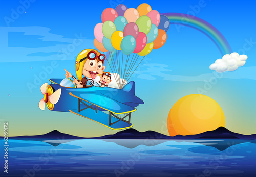 A plane with monkeys and balloons