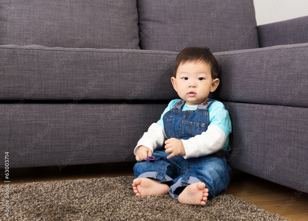 Asia baby boy sitting on carpet Asia baby boy sitting on carpet